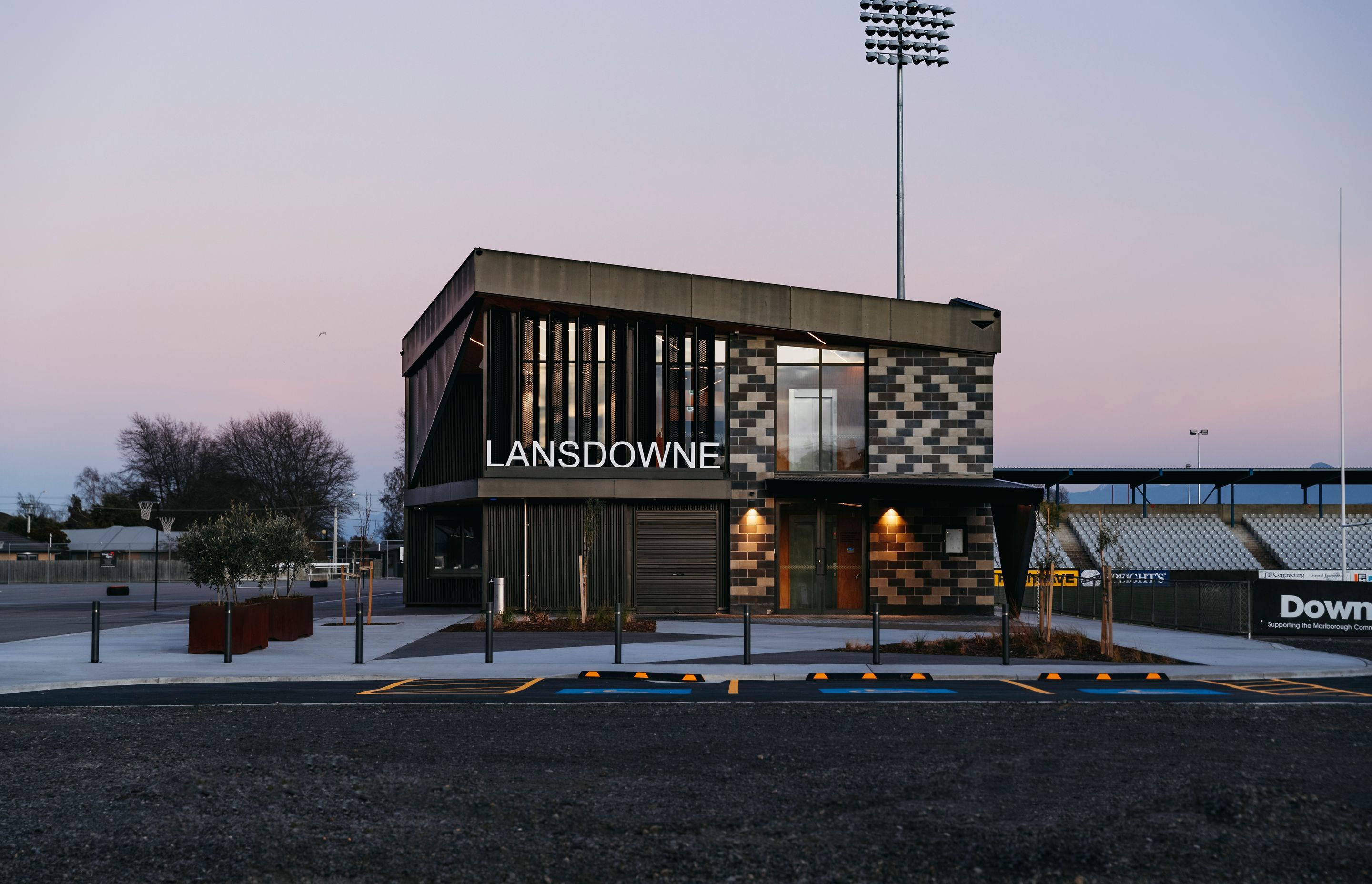The entrance faces the car park, and the netball courts are found on the left, with the rugby field on the right.