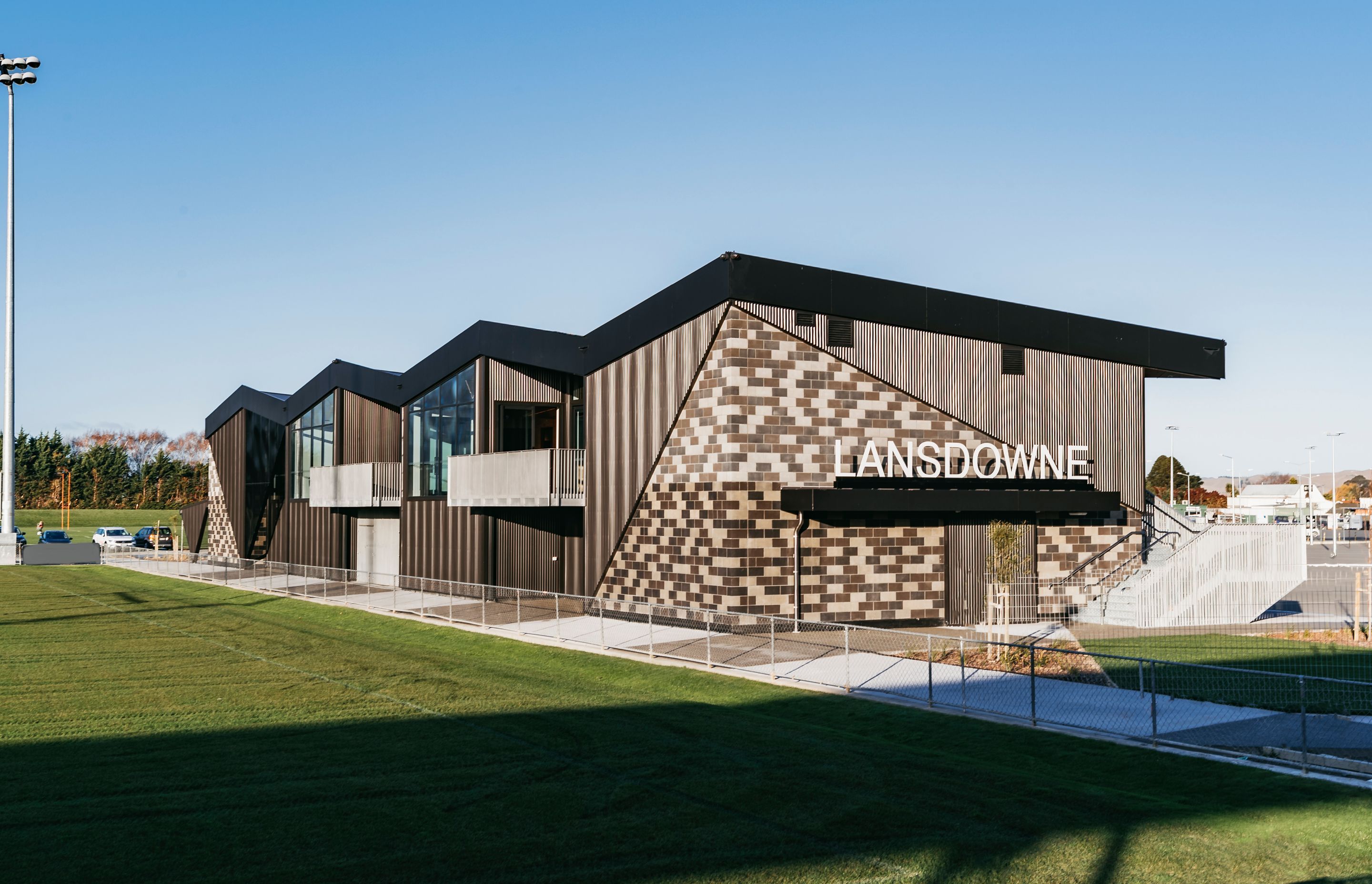 Each end of the building is bookended by angular ViBlock walls in a mixture of tones.