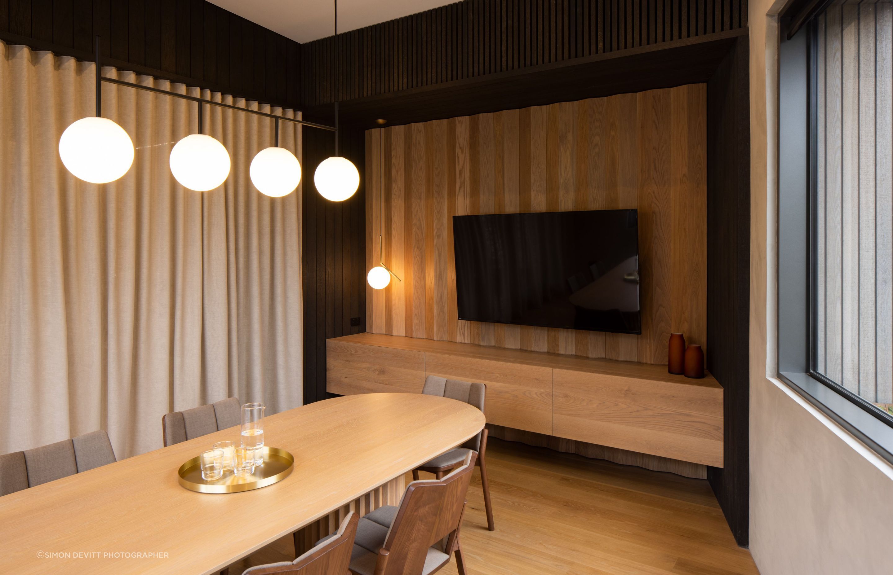 The boardroom table was custom designed to echo the faceted detail of the wall panelling. “We worked quite closely with the cabinetmaker on how that could be achieved,” says Roy.