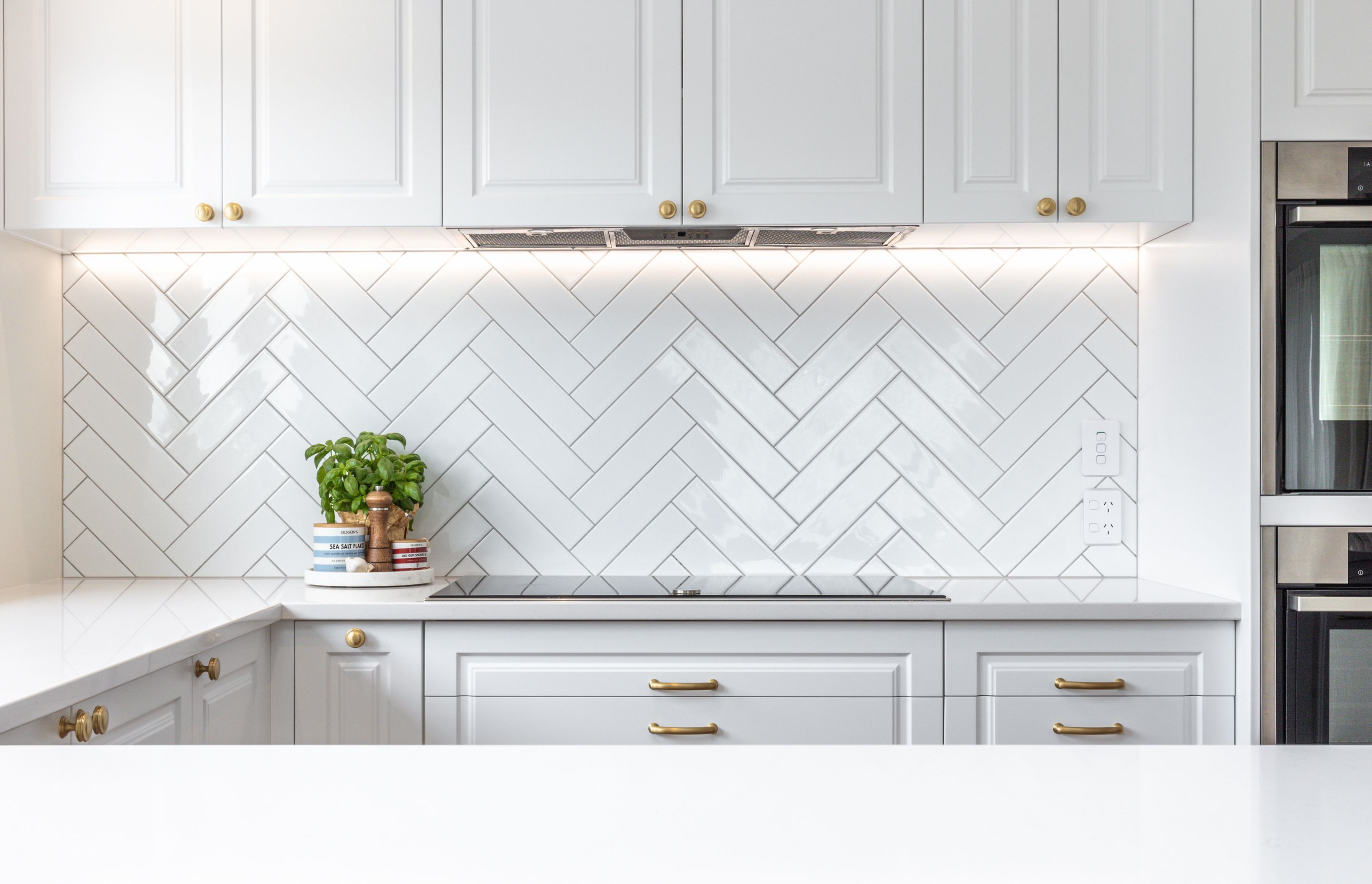 The kitchen is lit naturally by skylights.