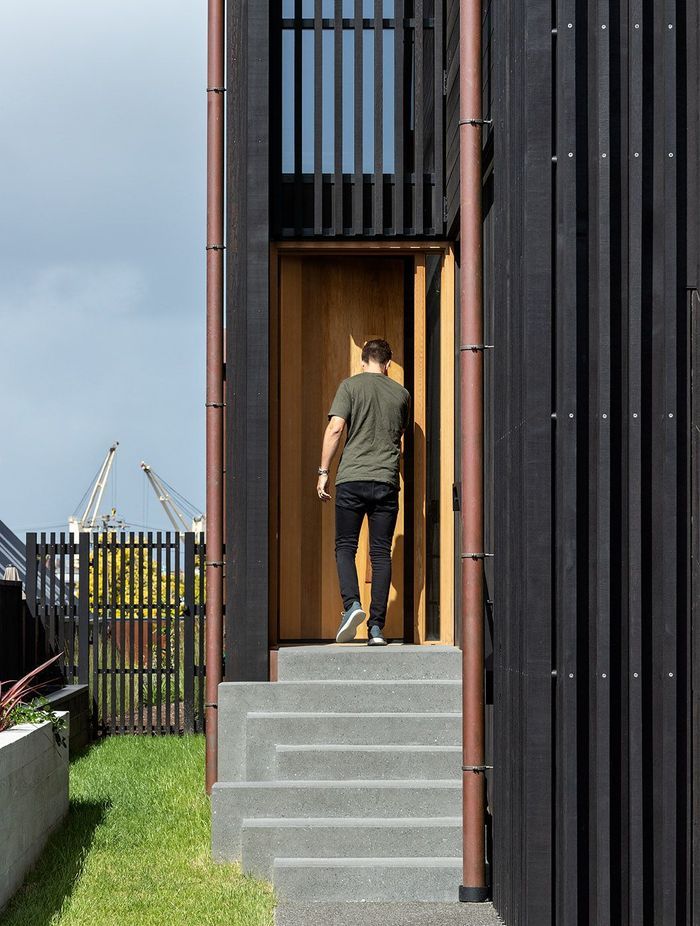 The entrance is tucked on the side of the home.