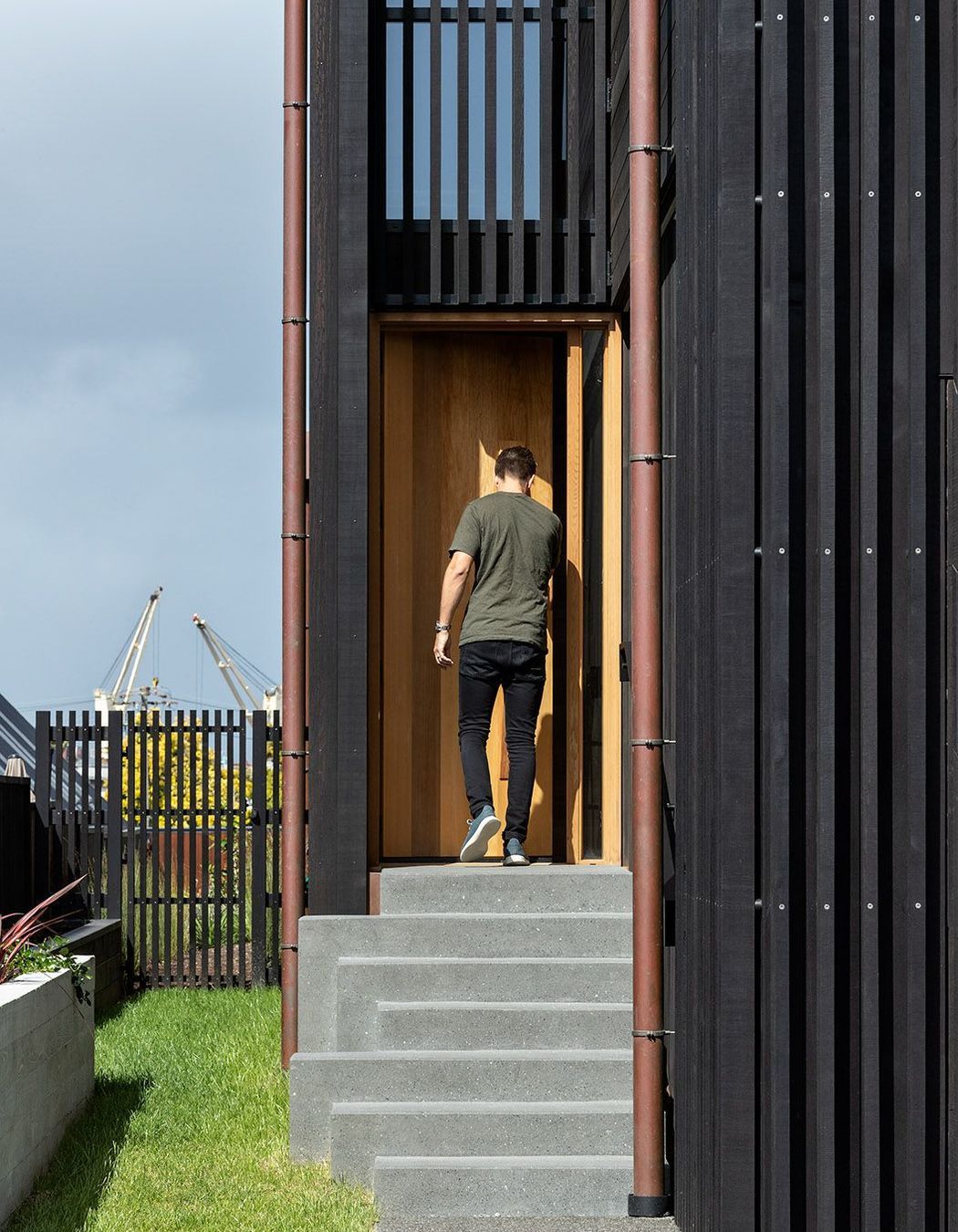 The entrance is tucked on the side of the home.