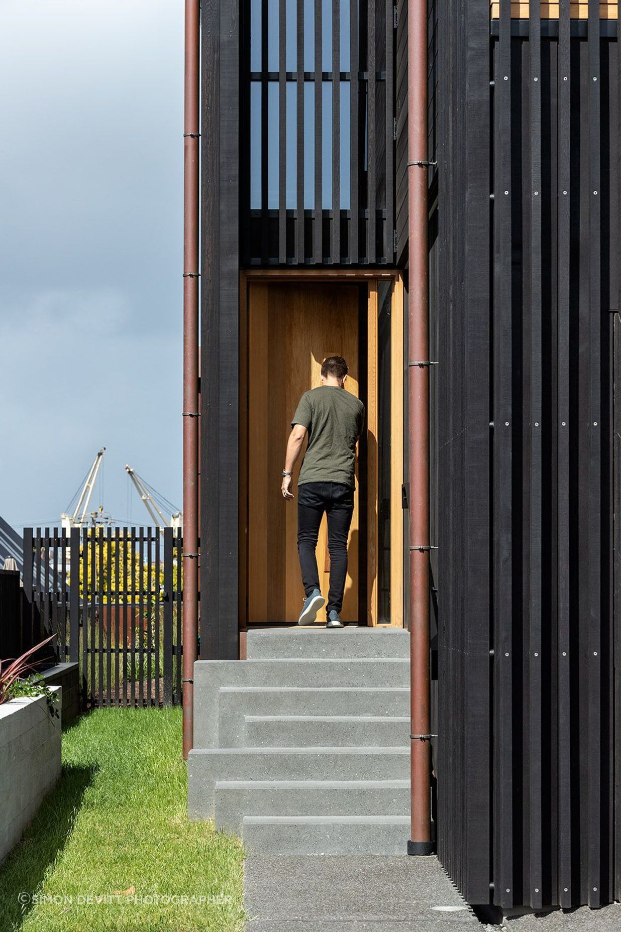 The entrance is tucked on the side of the home.