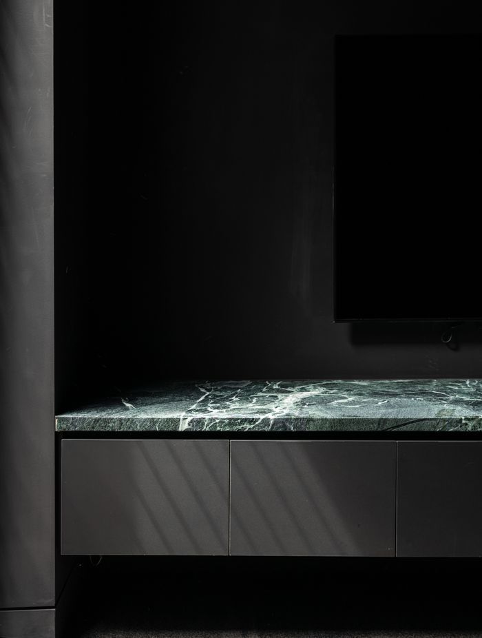Surrounded by black, the stone's natural veining becomes the focal point.