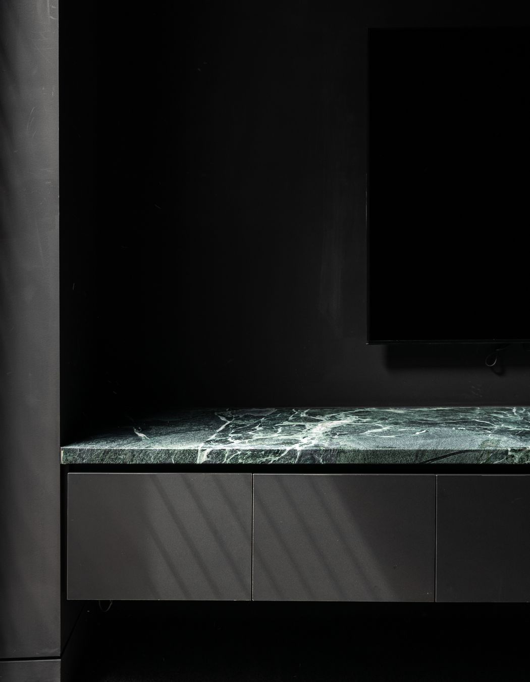 Surrounded by black, the stone's natural veining becomes the focal point.