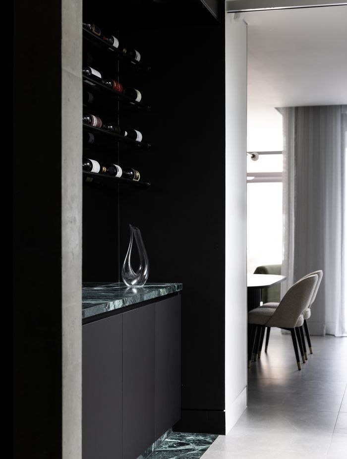 The wine bar is accented with Verde Alpi marble from CAV'ART Design Store.