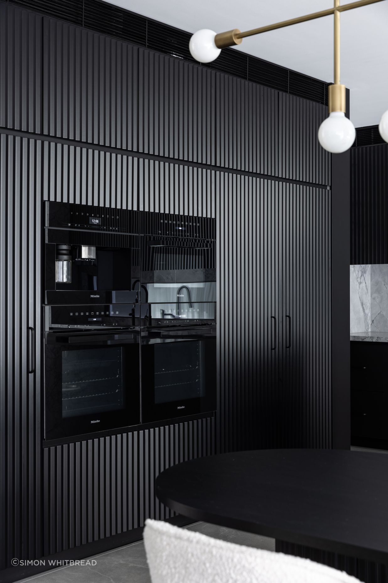 The cabinetry adds texture to the space.