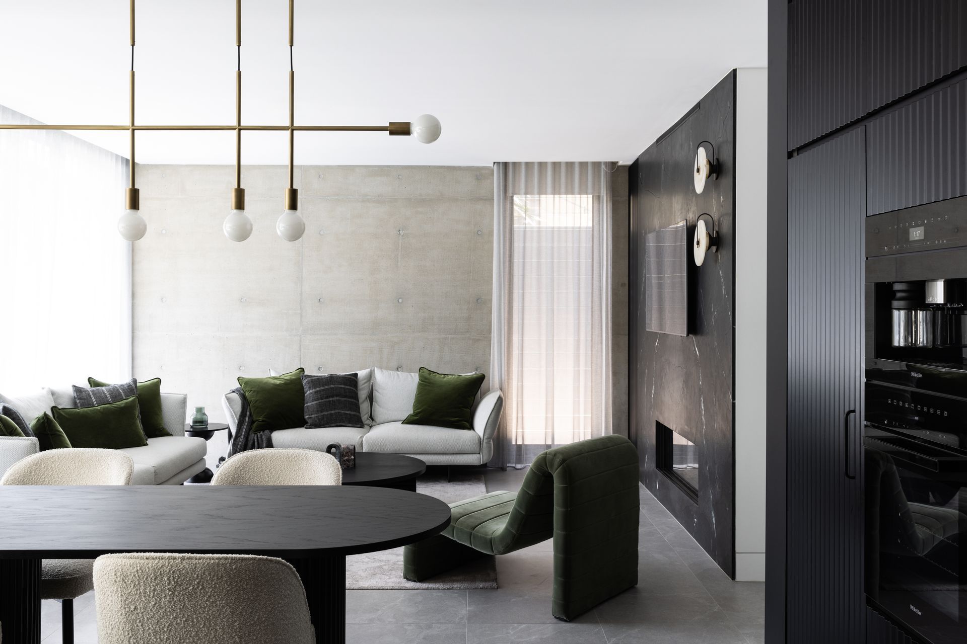 Pre-cast concrete panels are textural in the living area, helping the interior tie in with the home's exterior.