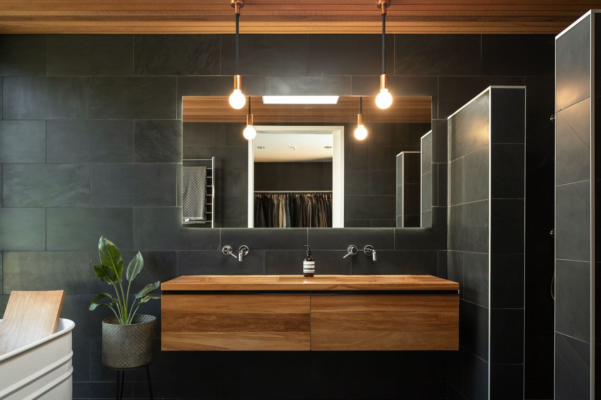 The clients led the interior design direction — a continuation of the rich exterior material palette.