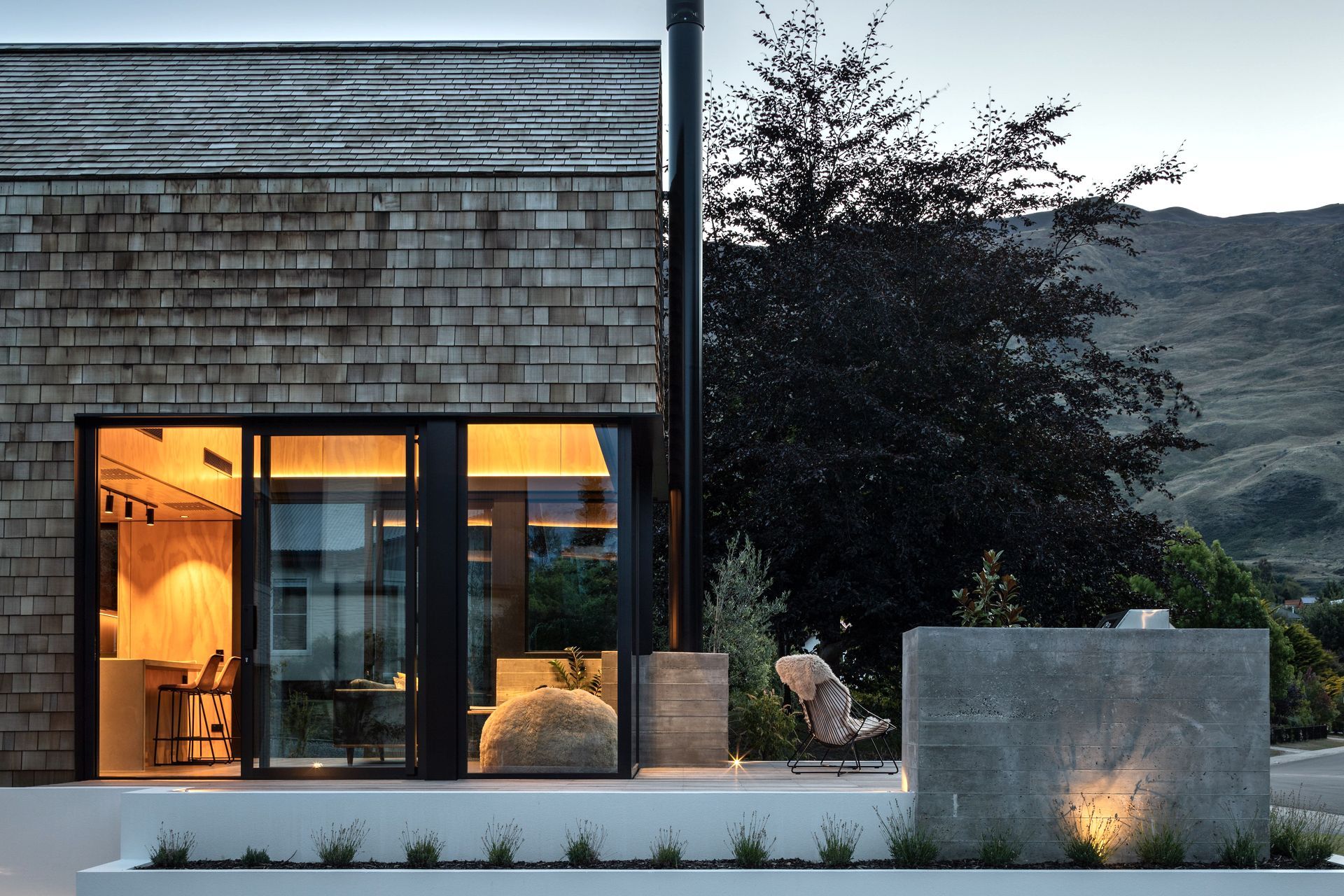 The cedar shingles are low-maintenance, ideal for the family that travels a lot, and the deck and glazing are perfectly designed to balance privacy while capturing views of Wanaka.