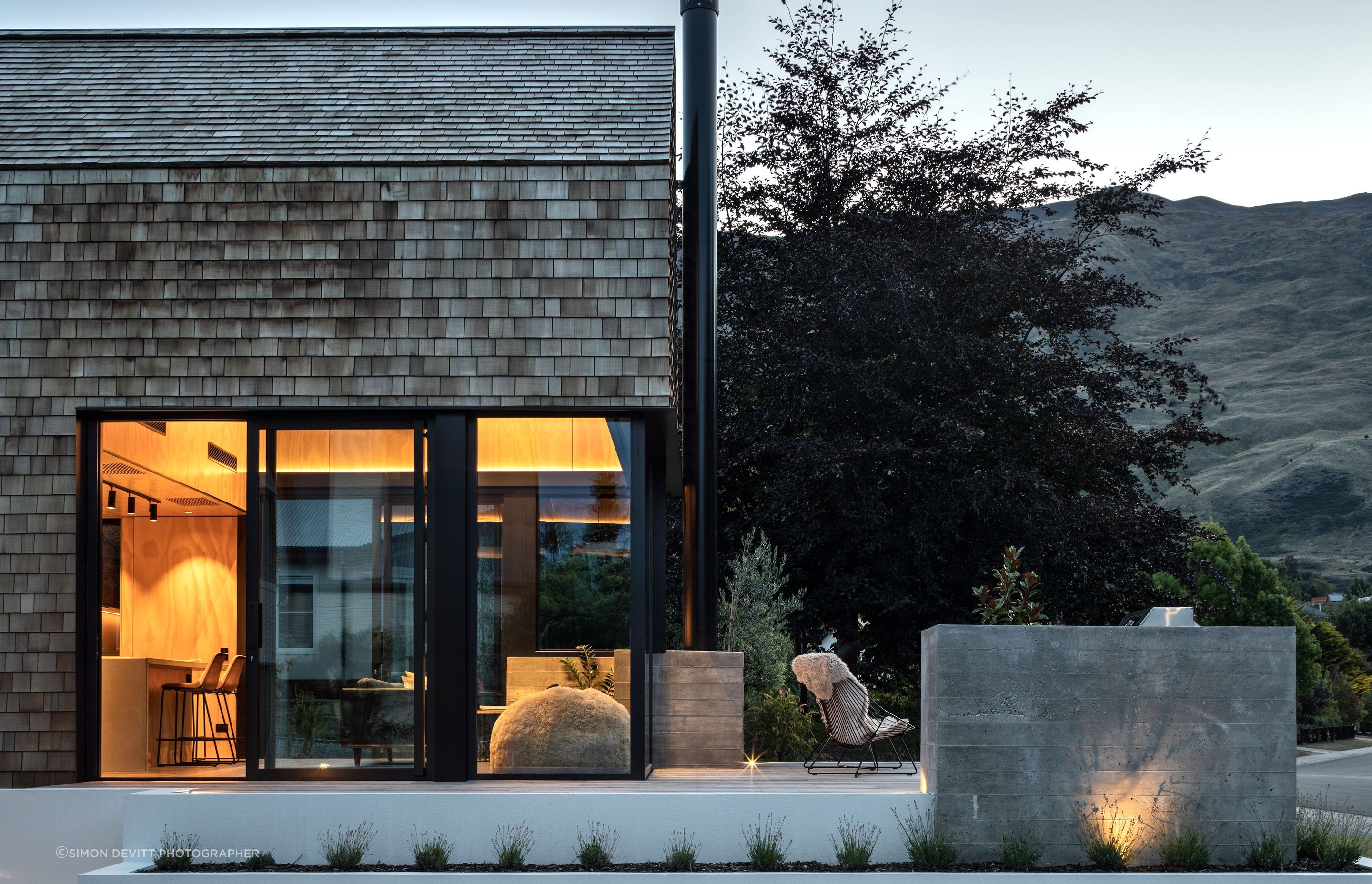 The cedar shingles are low-maintenance, ideal for the family that travels a lot, and the deck and glazing are perfectly designed to balance privacy while capturing views of Wanaka.