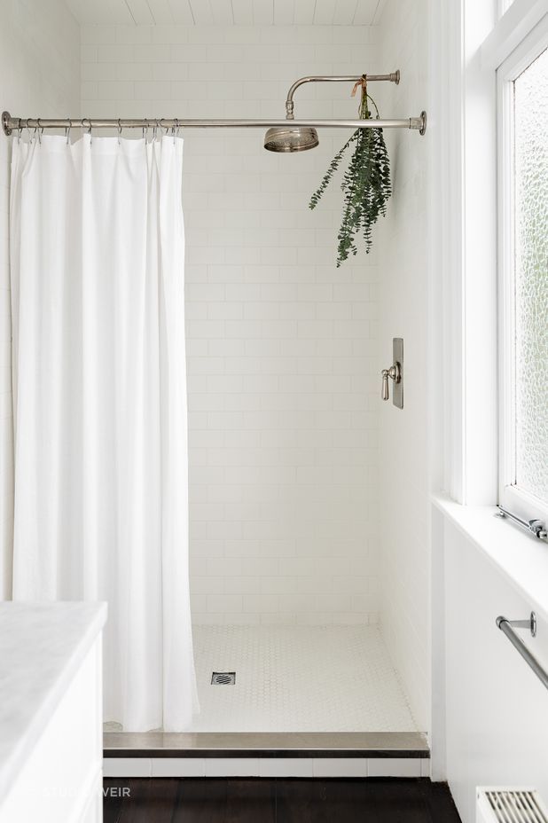 The same subway tiles used in the children's bathroom feature in the ensuite.