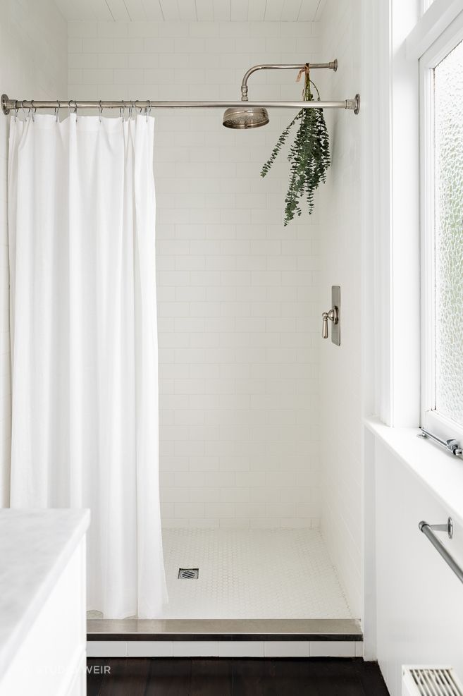 The same subway tiles used in the children's bathroom feature in the ensuite.