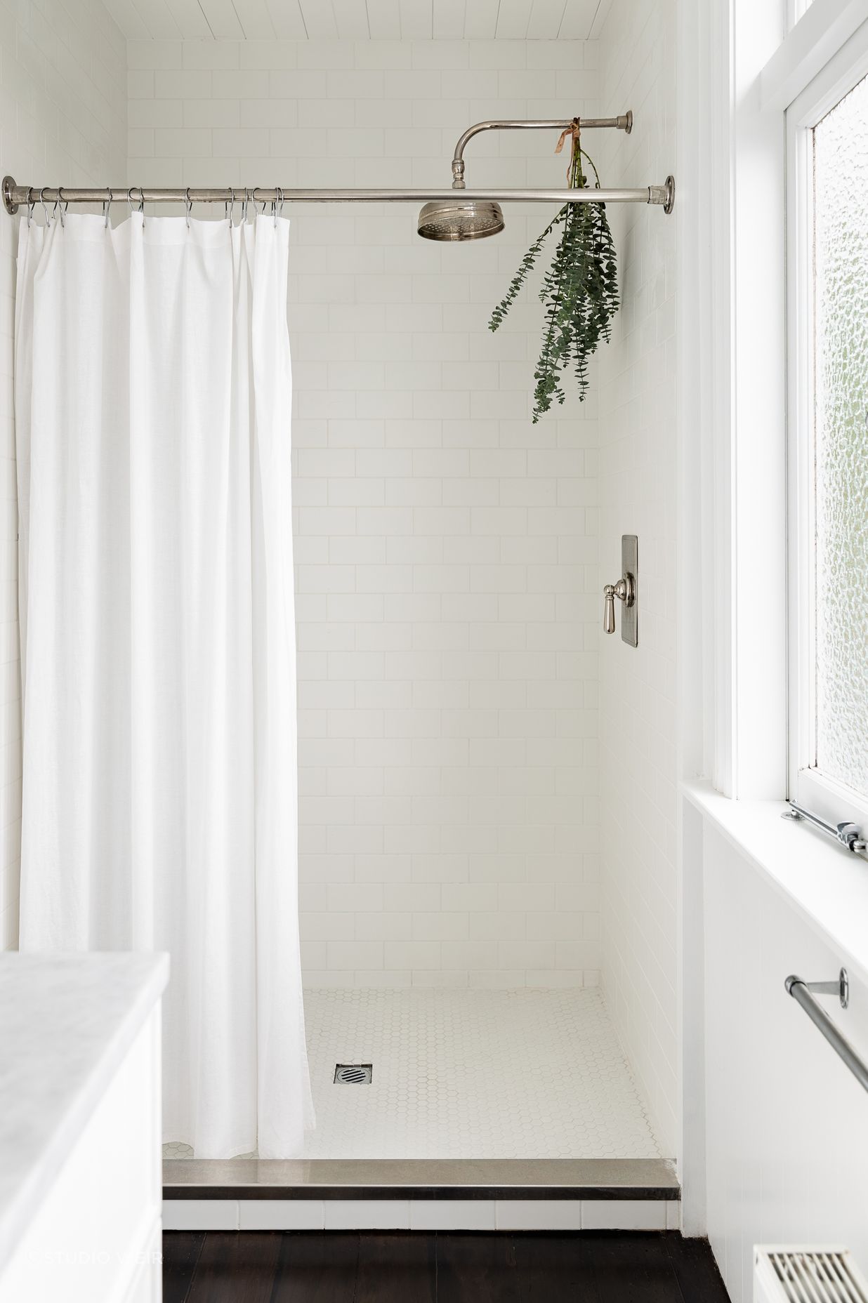 The same subway tiles used in the children's bathroom feature in the ensuite.