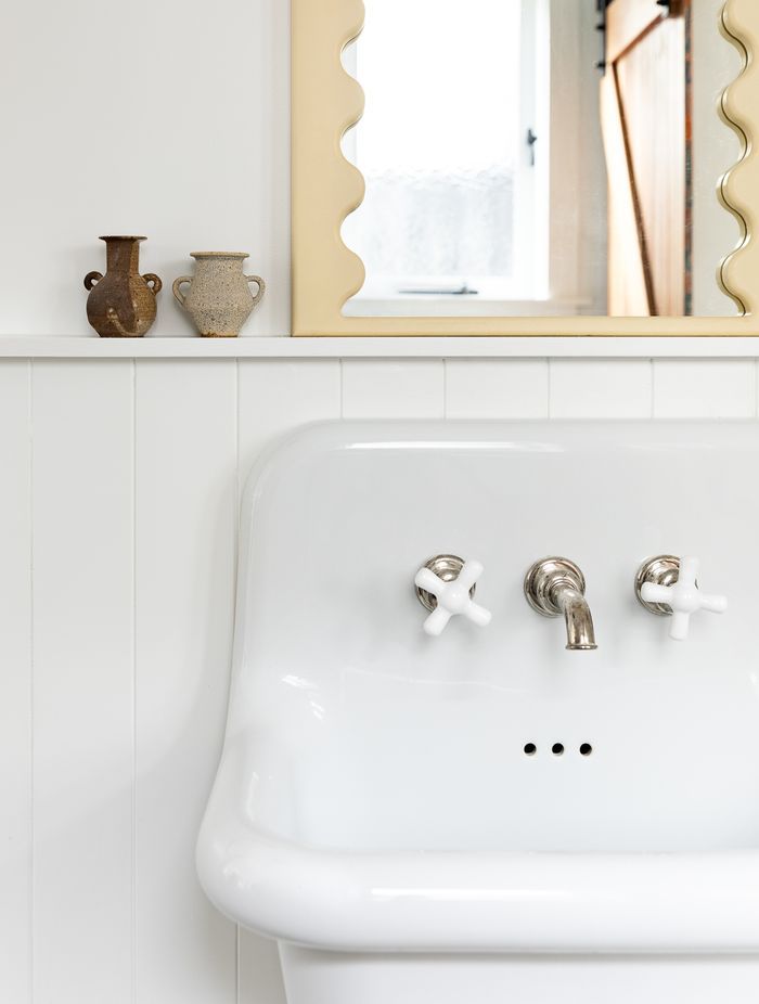 No attention to detail has been spared, with Perrin & Rowe tapware also used in the downstairs bathroom and the curved mirror detailing a nod to the mirror in the children's bathroom.