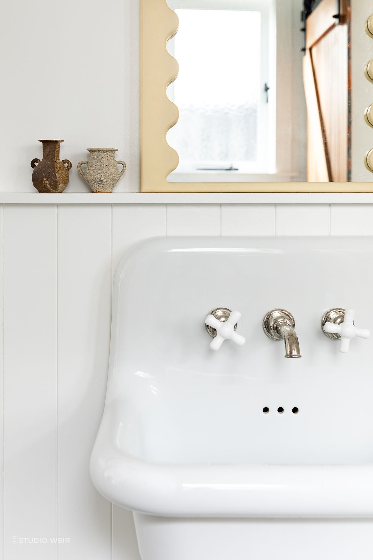 No attention to detail has been spared, with Perrin & Rowe tapware also used in the downstairs bathroom and the curved mirror detailing a nod to the mirror in the children's bathroom.