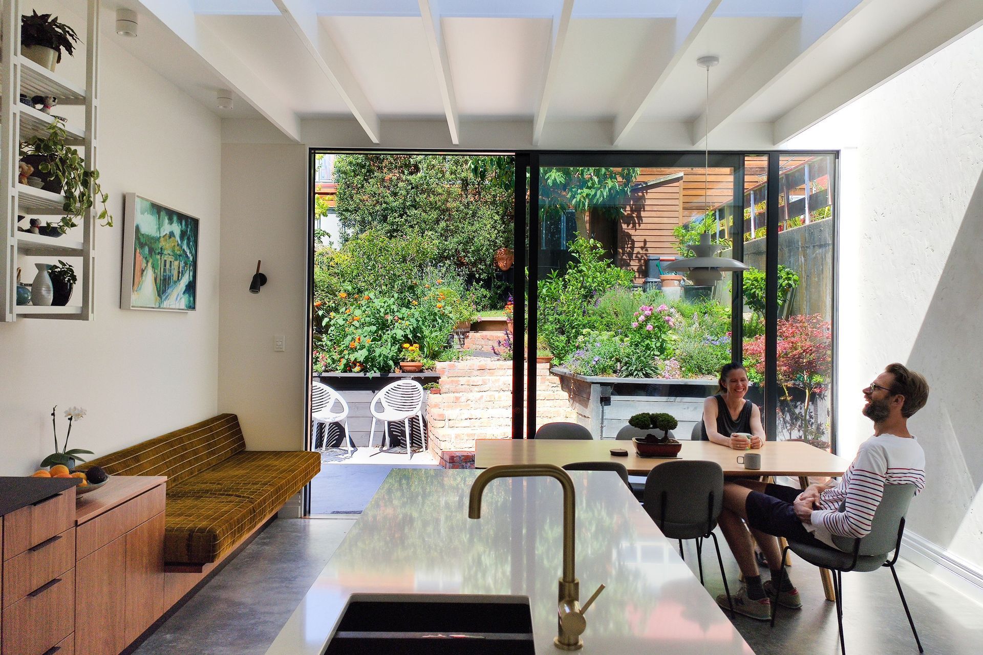 Fantastic interior design allows this lush back-garden courtyard to act as an extended dining and living space.