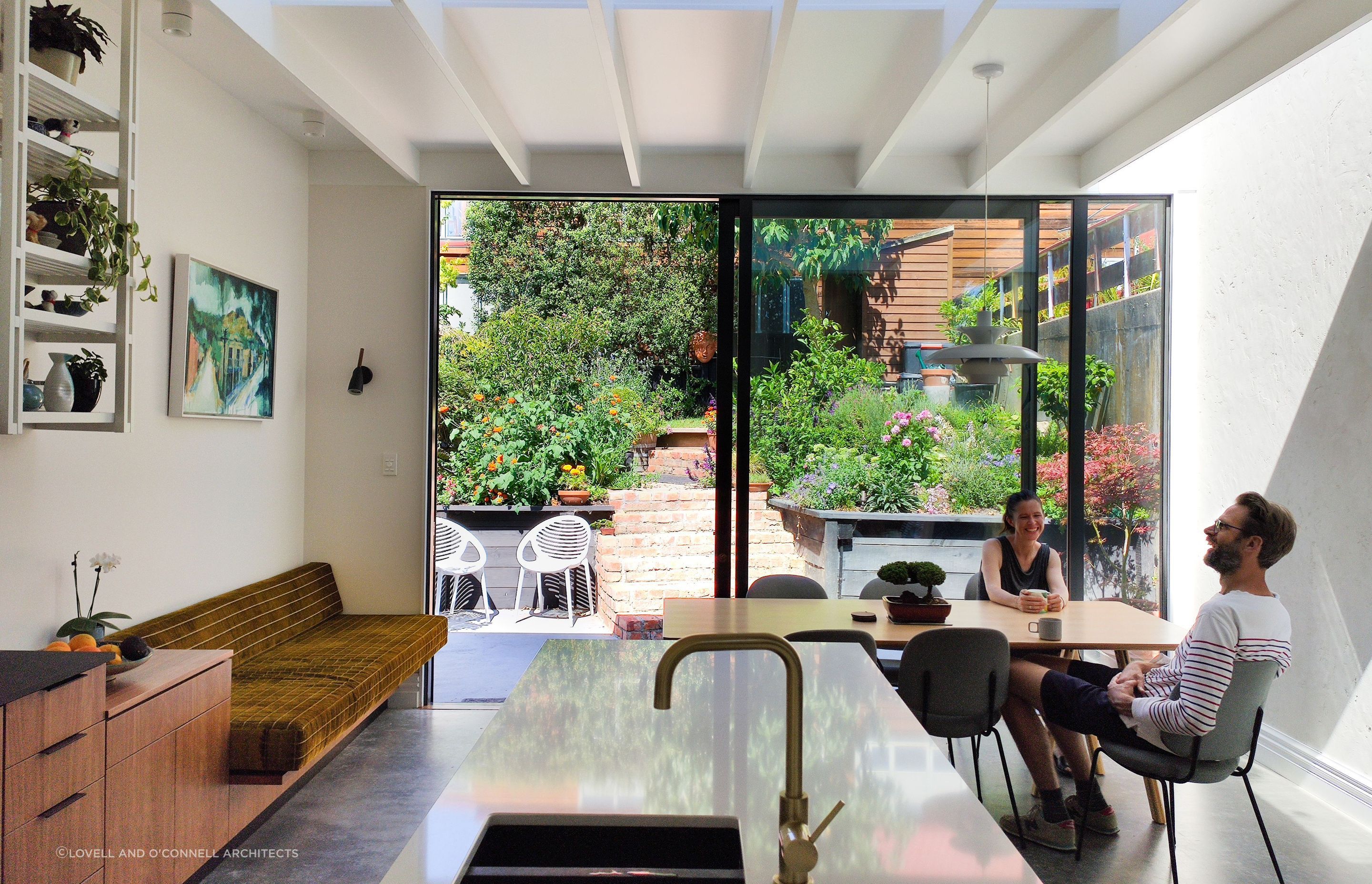 Fantastic interior design allows this lush back-garden courtyard to act as an extended dining and living space.