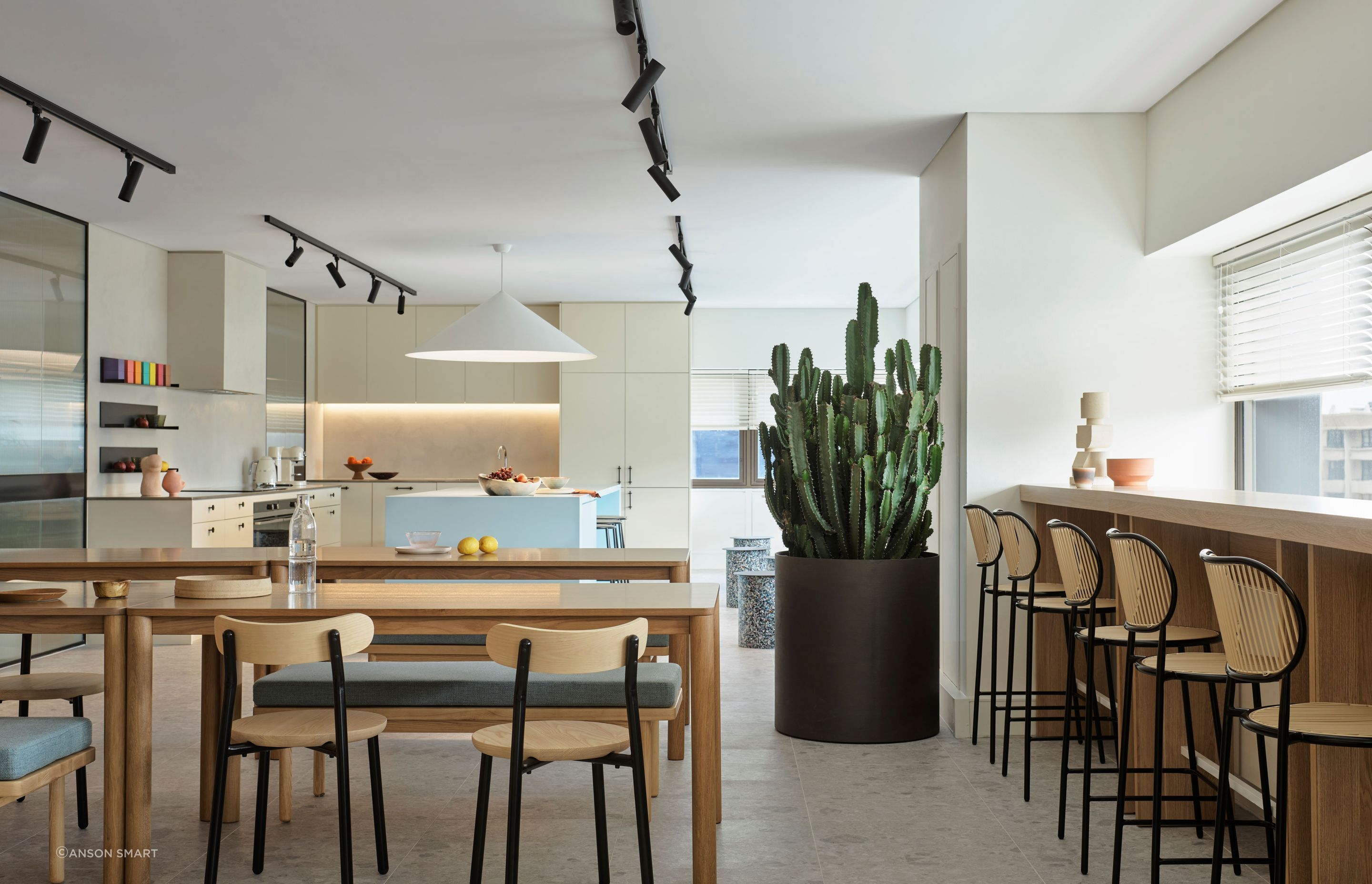 Familiar domestic shapes like bentwood stools and timber tables were used to make the kitchen feel cosy and inviting.