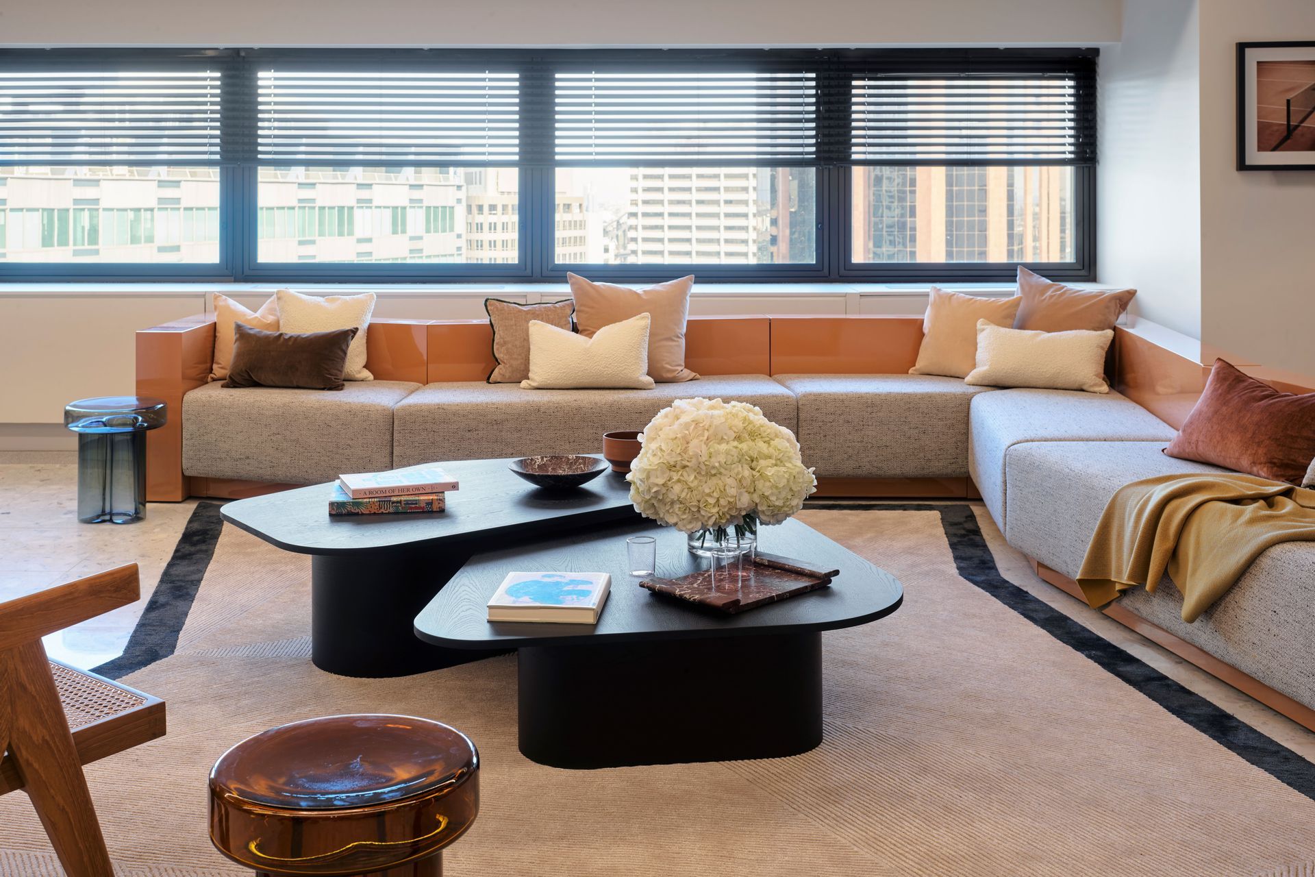 The huge peach coach in the reception space is the perfect place for company meetings and for visitors to wait to enter the offices.