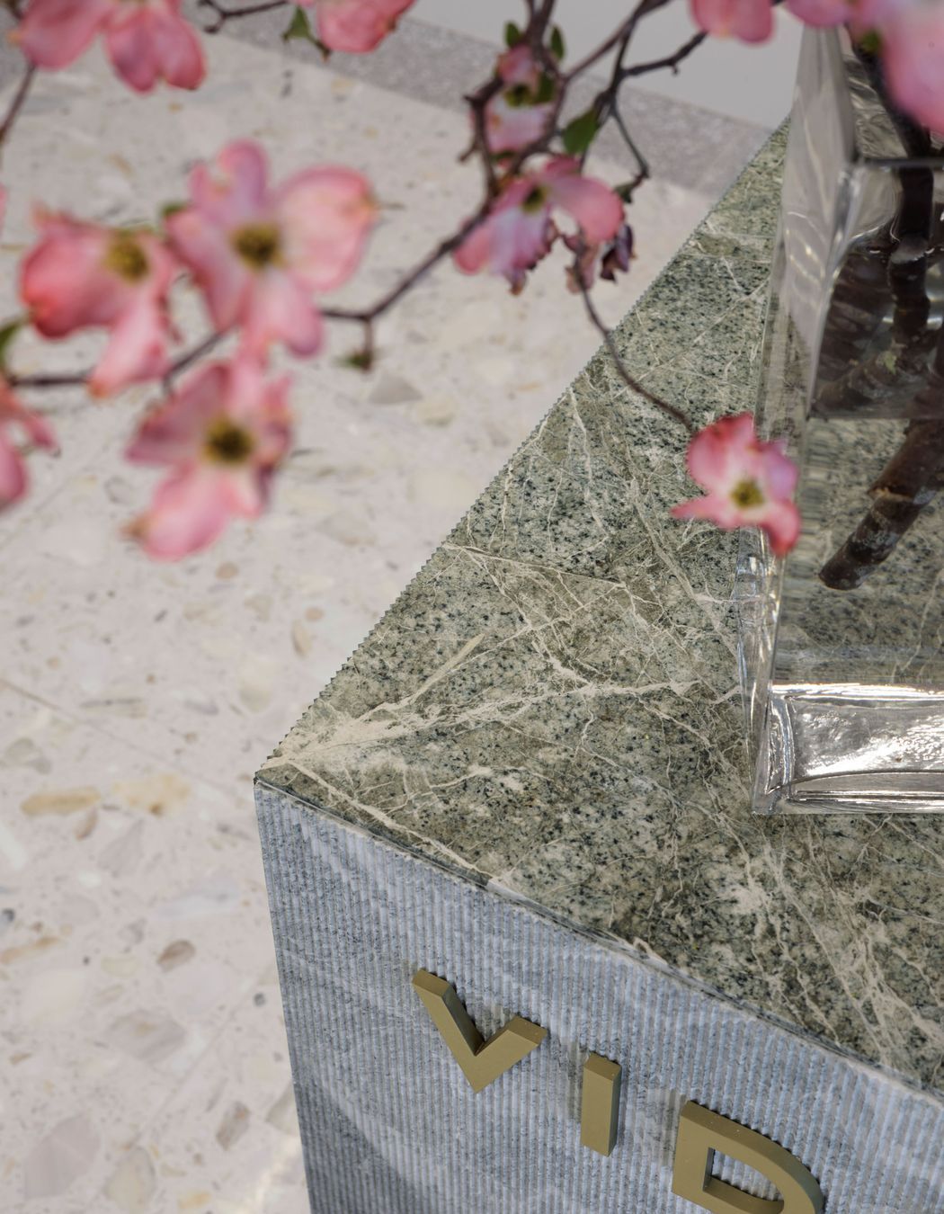 The stunning parsley green stone of the 'collagen bar' is ribbed on the sides, but flat and shiny on the top surface.