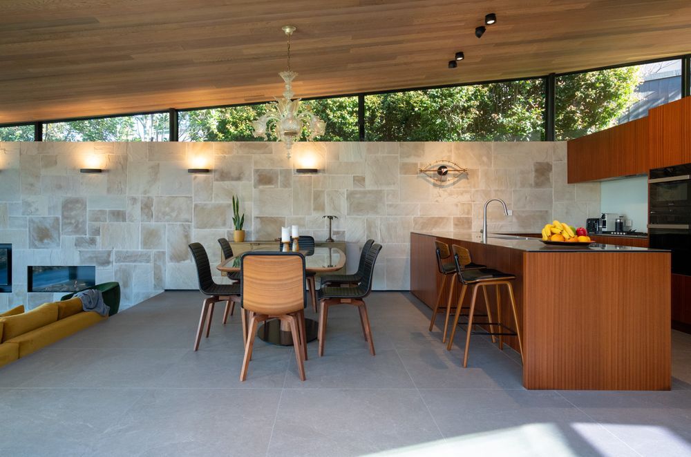 Textures reminiscent of the surrounding environment feature throughout the home's interior.