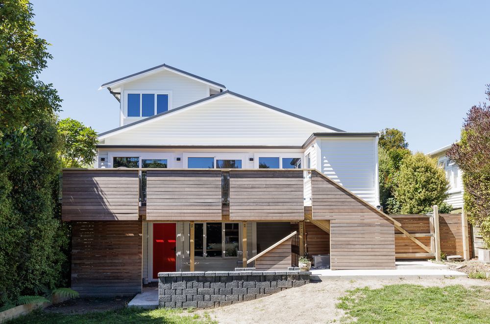 The home received a full transformation, from front to back. The hardwood deck has been a welcome addition for the clients.