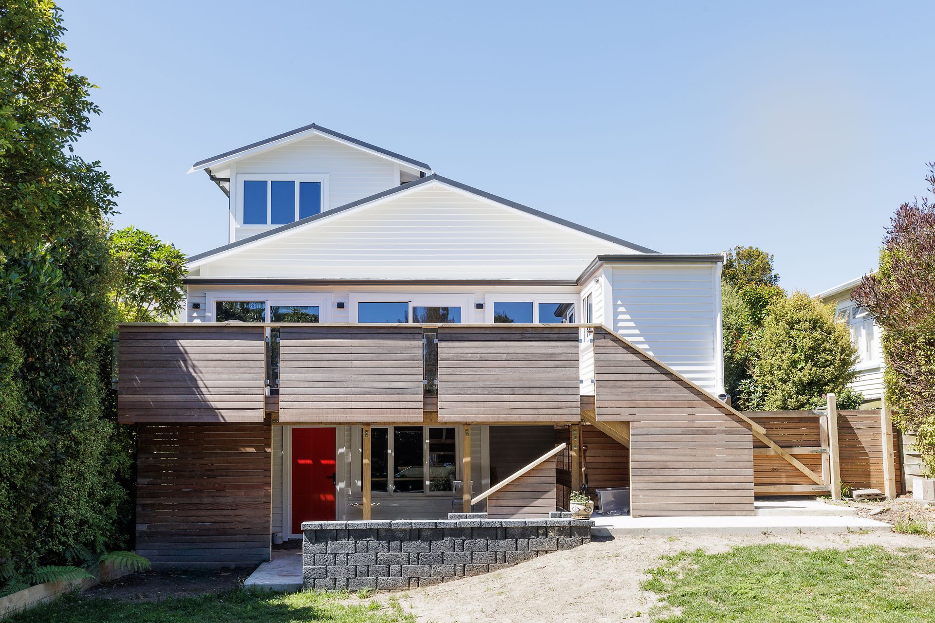 The home received a full transformation, from front to back. The hardwood deck has been a welcome addition for the clients.