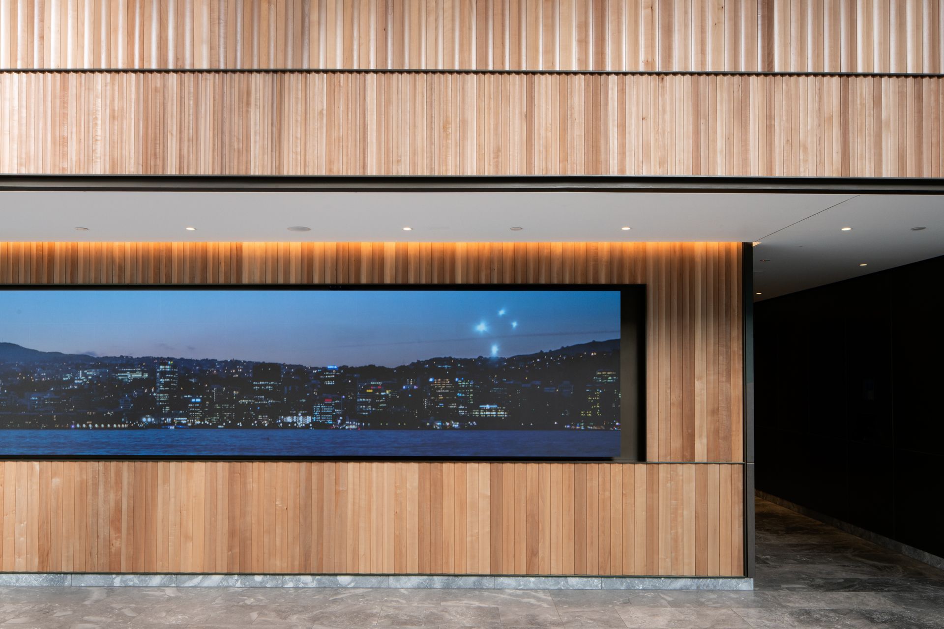 The interior architecture of the public spaces includes timber, brass and marble finishes.