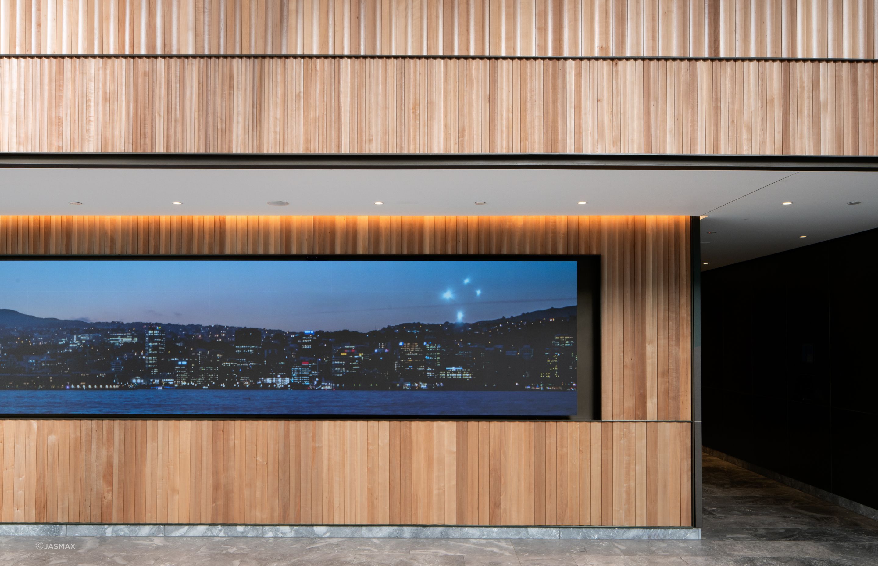 The interior architecture of the public spaces includes timber, brass and marble finishes.