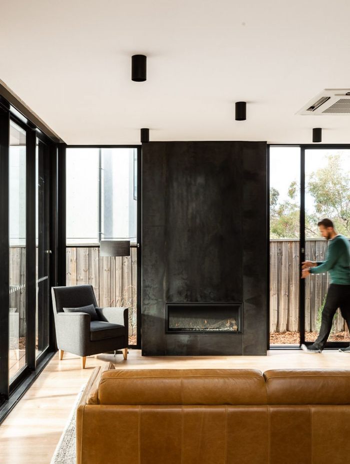 The fireplace can be seen on entry to the home and anchors the lounge area.