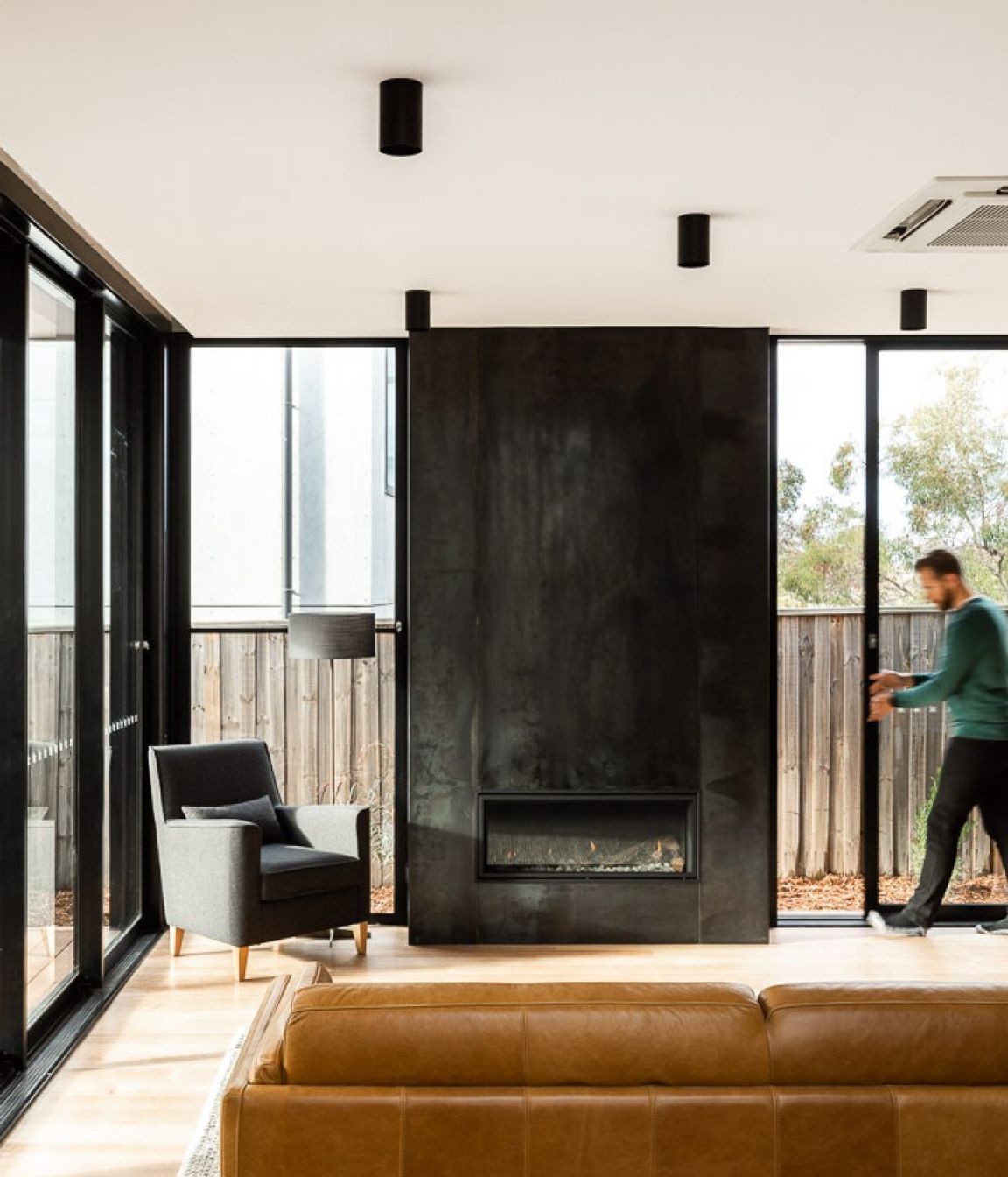 The fireplace can be seen on entry to the home and anchors the lounge area.