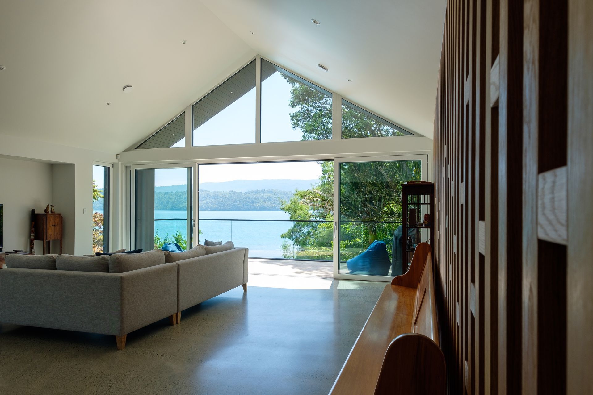 A natural flow between indoor and outdoor spaces and a handcrafted oak feature wall (right) bringing designer flair.