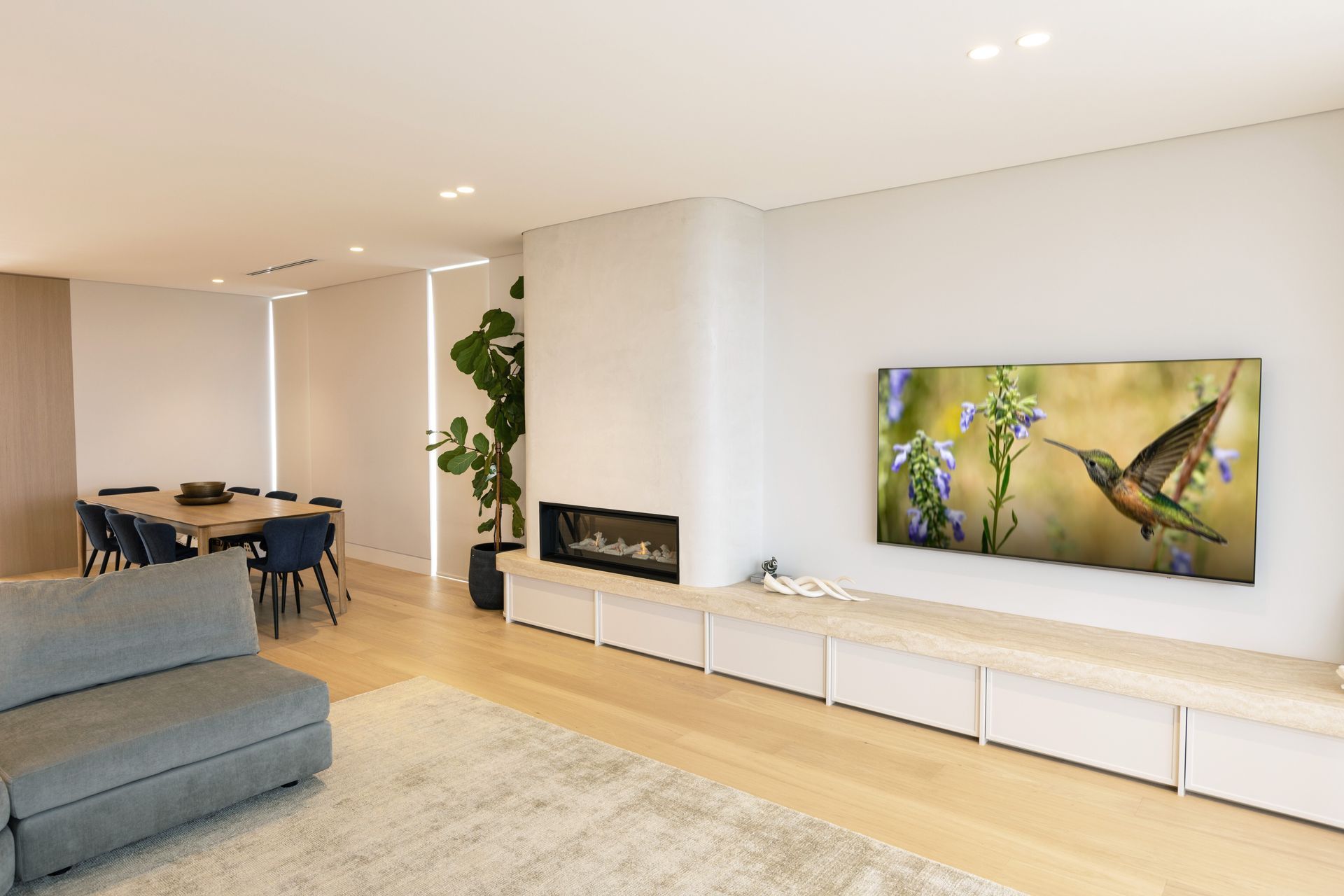 “On this ground floor, above the basement, you have the guest bedroom, powder room, living, kitchen and dining, and an elevator that connects the three levels.”