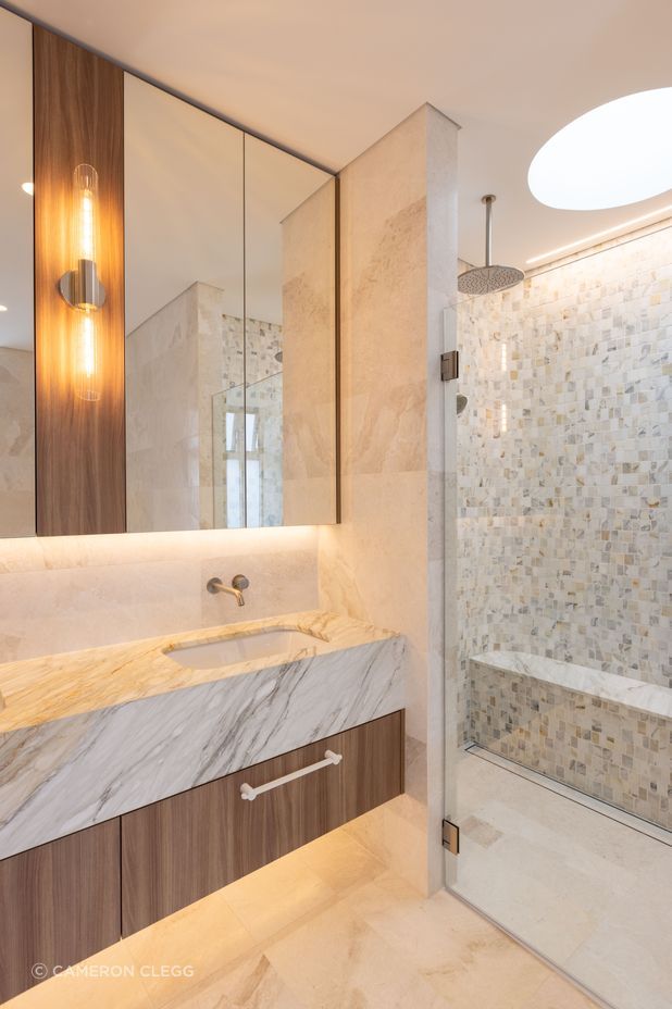 Natural tones, textures and shapes continue throughout this architectural home.