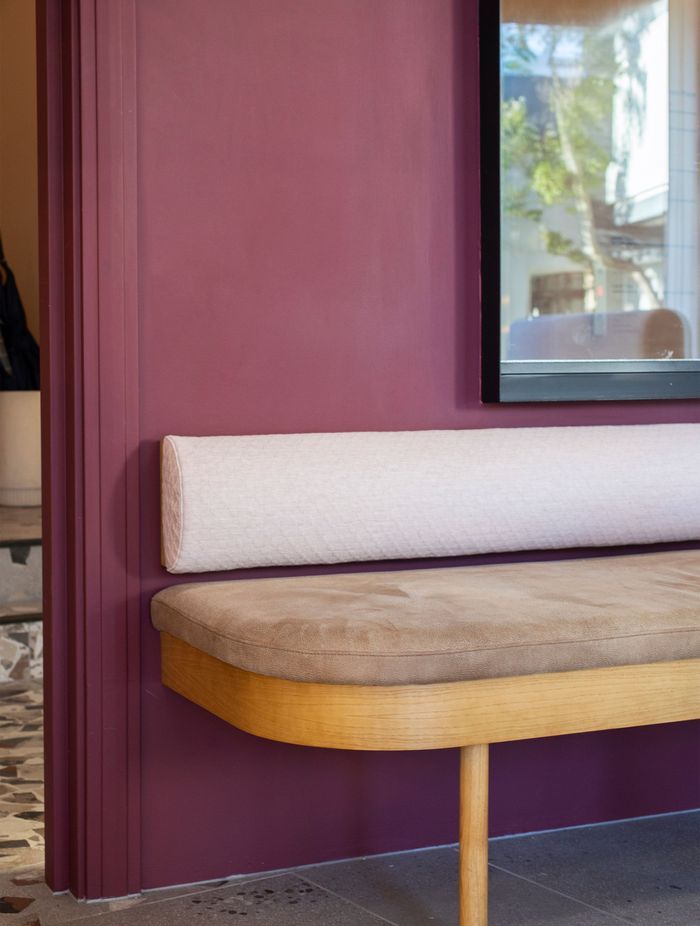 Boysenberry walls offset the custom seating and backrests – originality abounds.