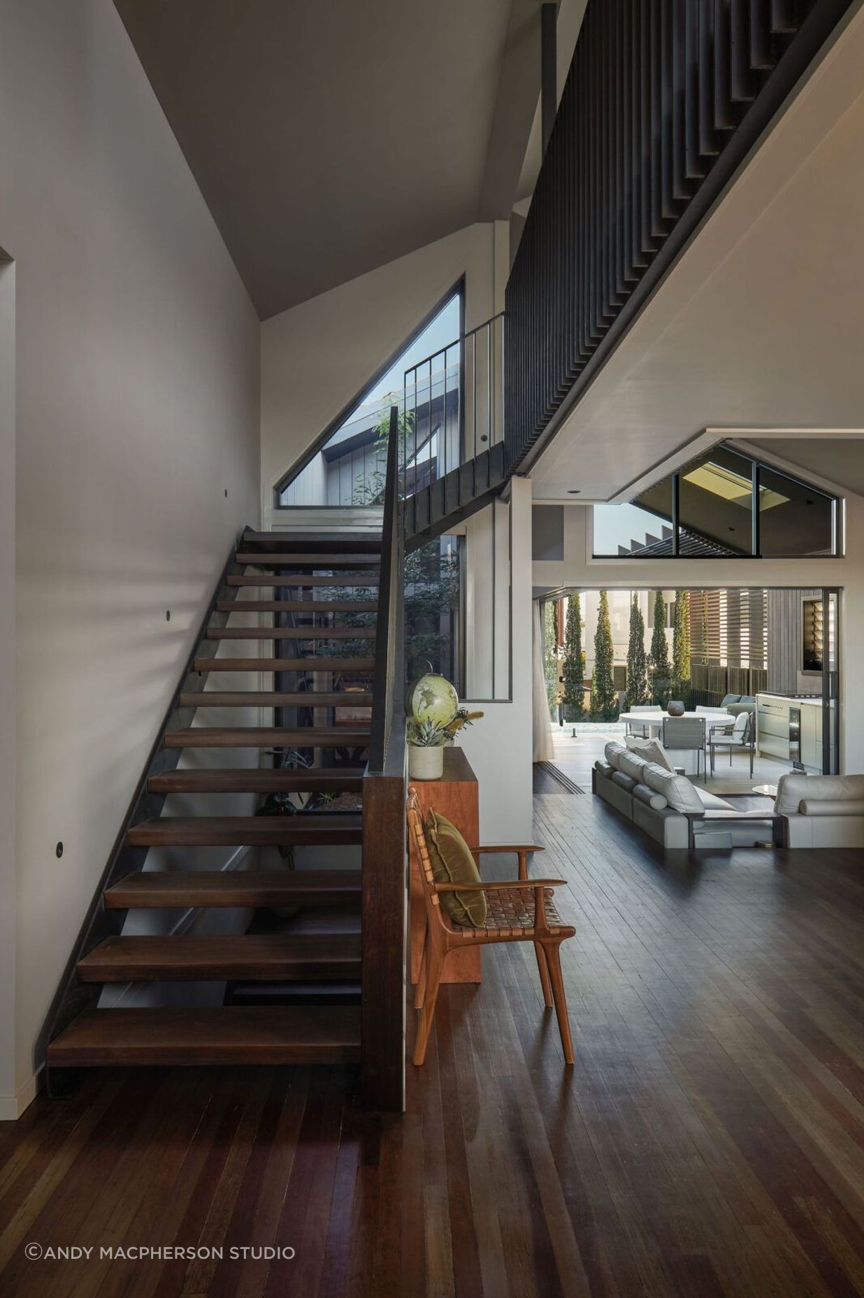 Vertical connectivity is achieved both visually and physically via the open riser stair and central atrium allowing an unobstructed line of sight between the living area and loft, making the space feel more expansive.