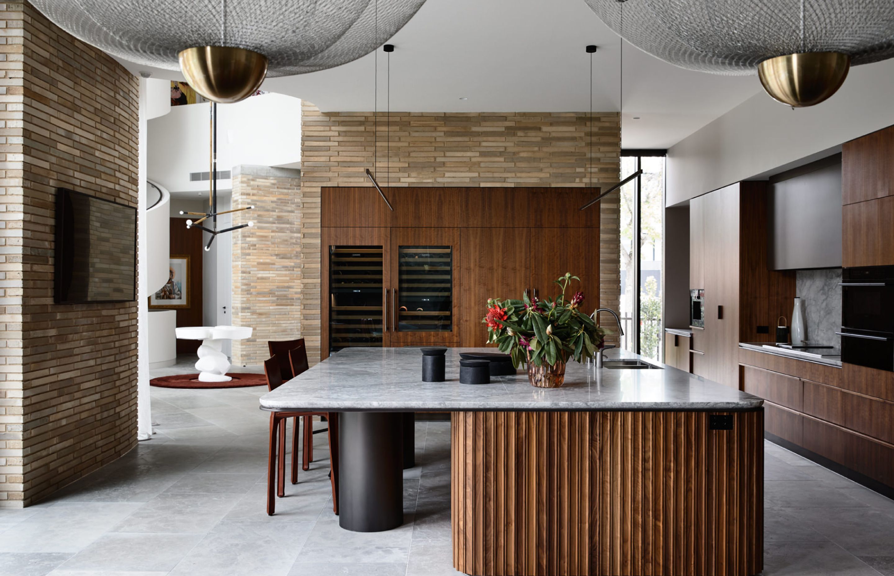 Rich materiality lends a feminine touch to this Brutalist entertainers’ paradise