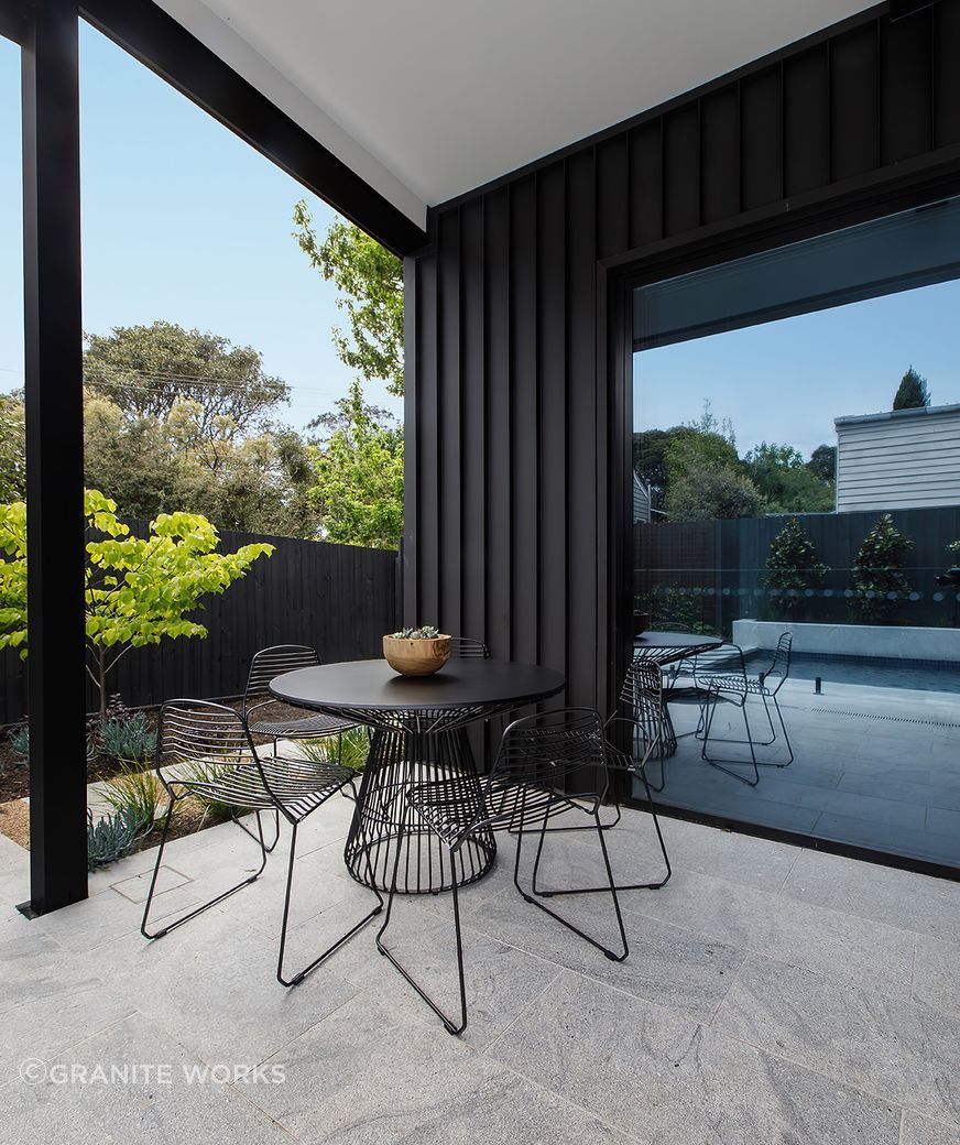 Aston grey granite complements the modern extension.