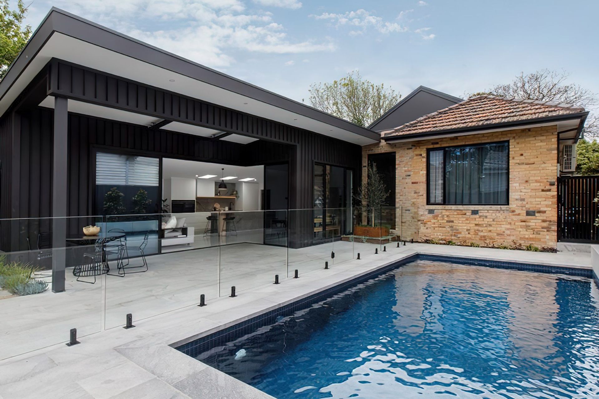 The 1950s cream clinker-brick façade contrasts with modern Colorbond in Monument.