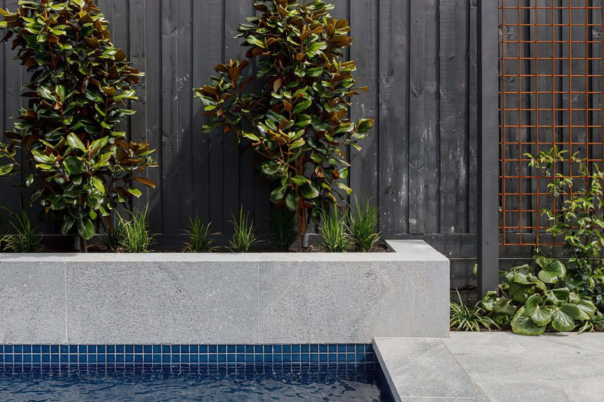 Granite Works stone coping surrounds to pool.