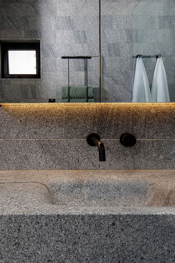 Granite Works installed floating stone basins; weighing over 300kg.