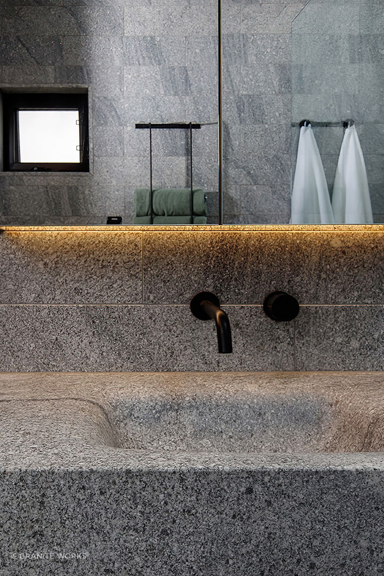 Granite Works installed floating stone basins; weighing over 300kg.