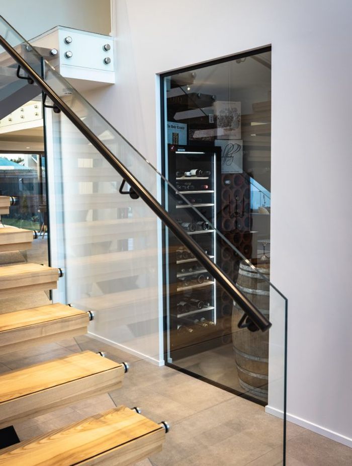 Answering the brief to be an 'entertainer's home', the entrance is complete with a wine cellar for the homeowner's impressive collection.