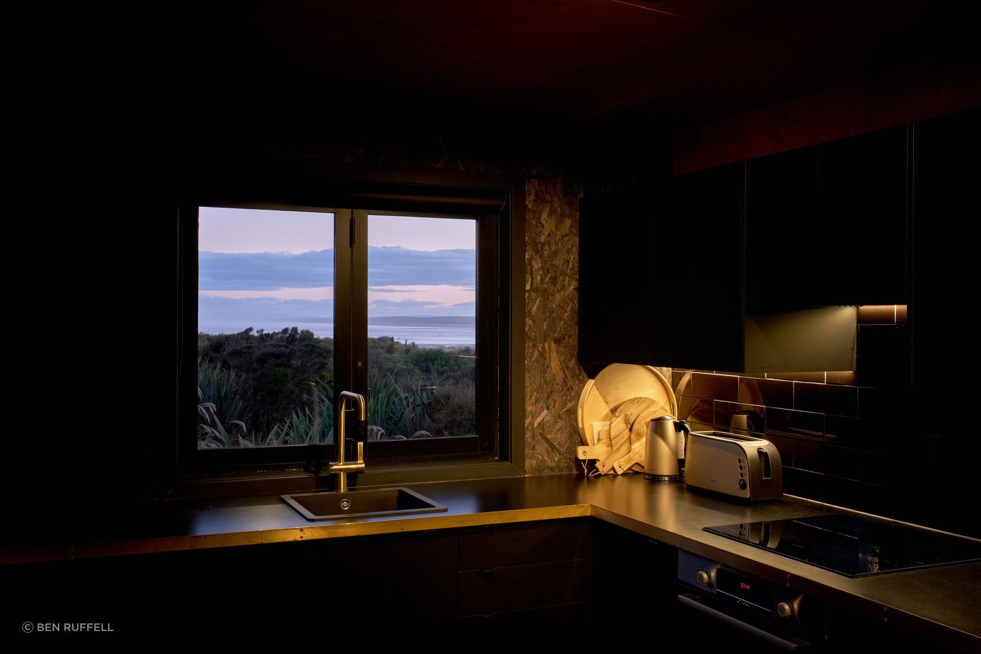 The interior colour palette reflects the colours of each external form, using brown accents in the brown form and black accents in the black form.