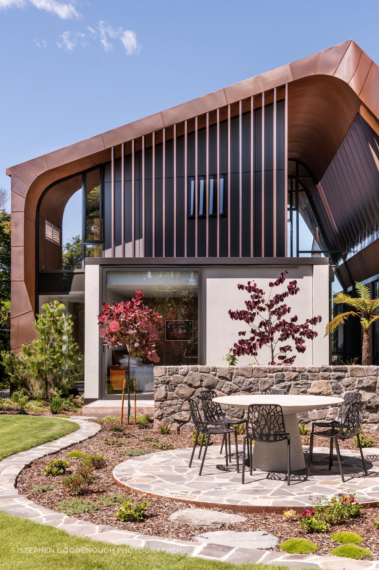 “The clients were wanting something durable, and the concrete and copper will both age naturally and potentially last for hundreds of years. Longevity of the home was part of the brief. We tried to get the concrete as white as we could then had the dark upper floor to really highlight the copper.”