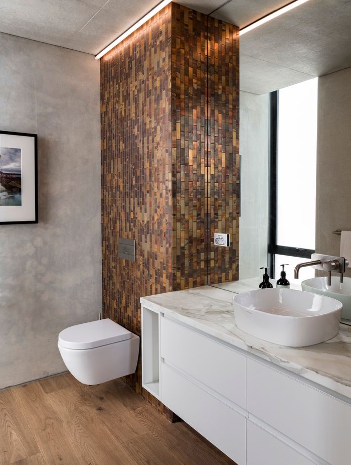 The copper tile was chosen to tie into the house's exterior materials.