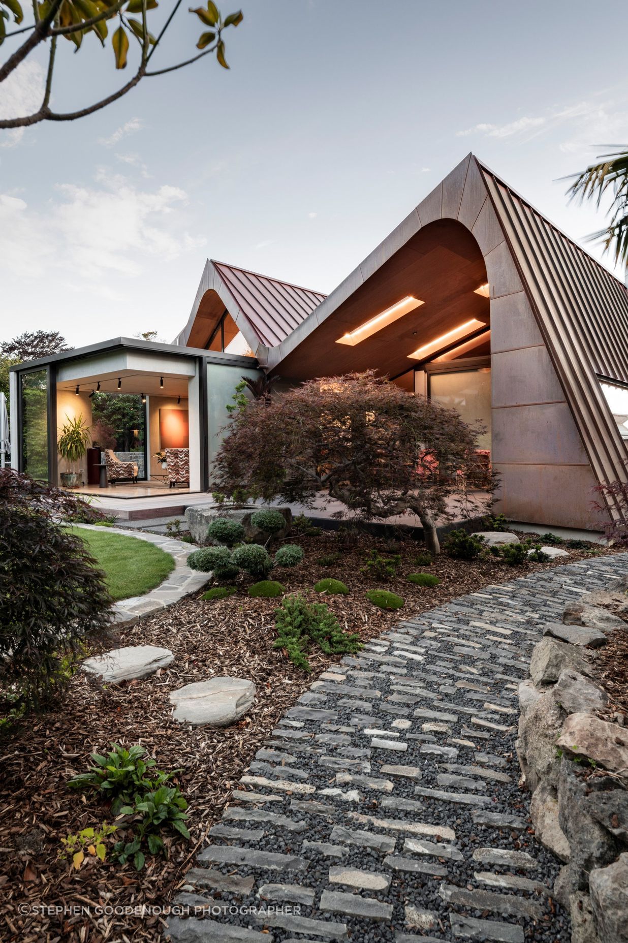 Landscaping was designed by Kamo Marsh. In the outdoor living area, the skylights also have LED lighting, says Craig. “It feels like they glow even at night.”