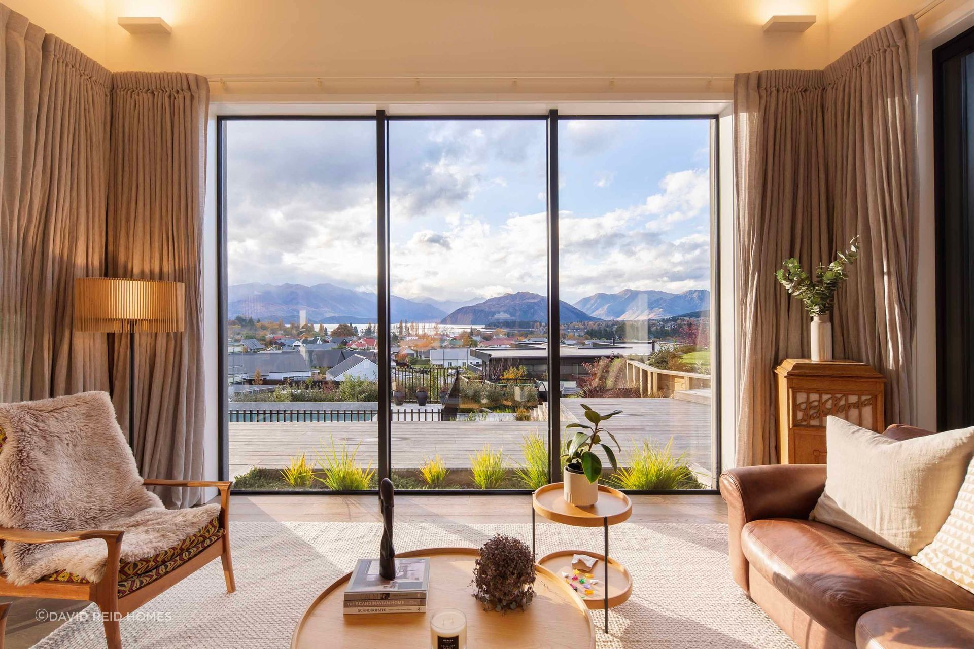 The step-down living room looks out over Lake Wānaka.