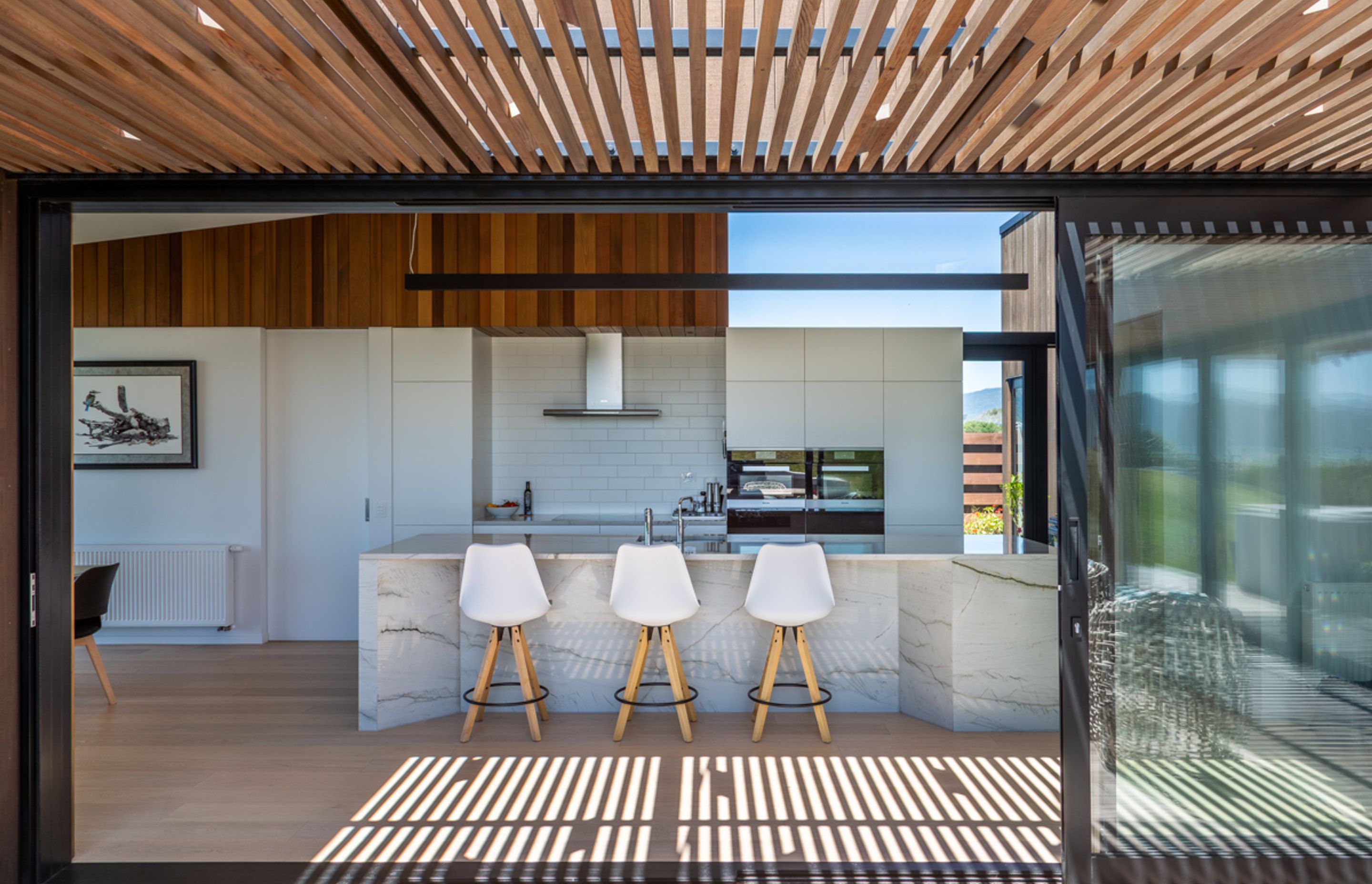 The kitchen, which is placed in the intersection between the four 'pods' of the home.